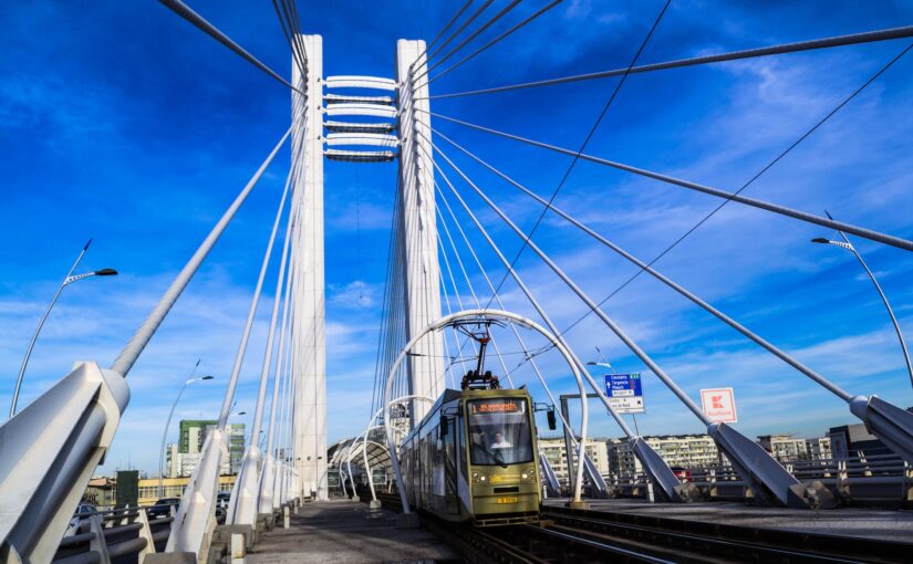 bridge with train under blue sky